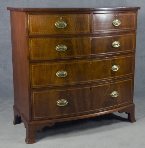 Appraisal: English Mahogany Bow-Front Chest of DrawersCirca Having two-over-three dovetailed drawers