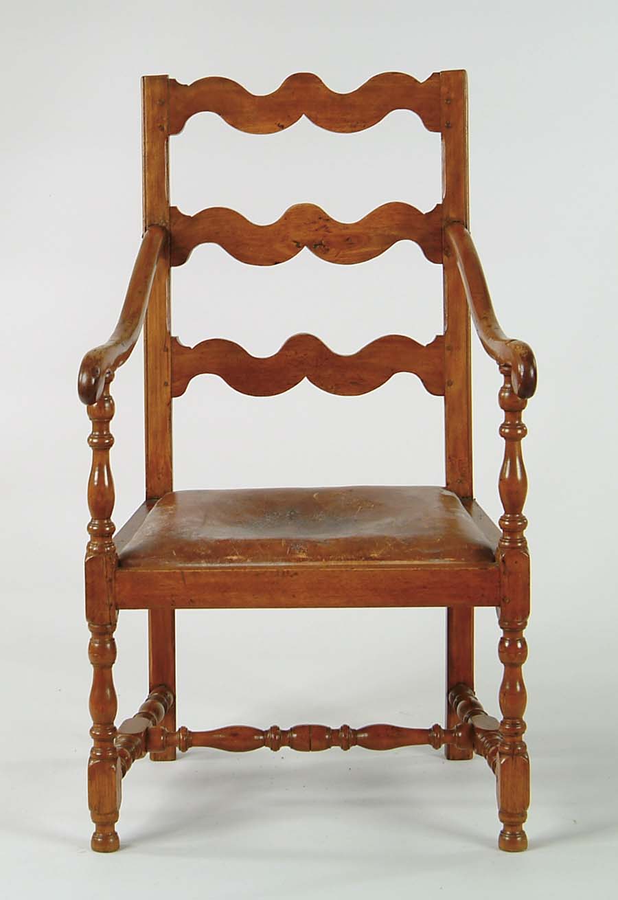 Appraisal: CANADIAN LADDERBACK ARMCHAIR Three wavy horizontal slats down curving scroll