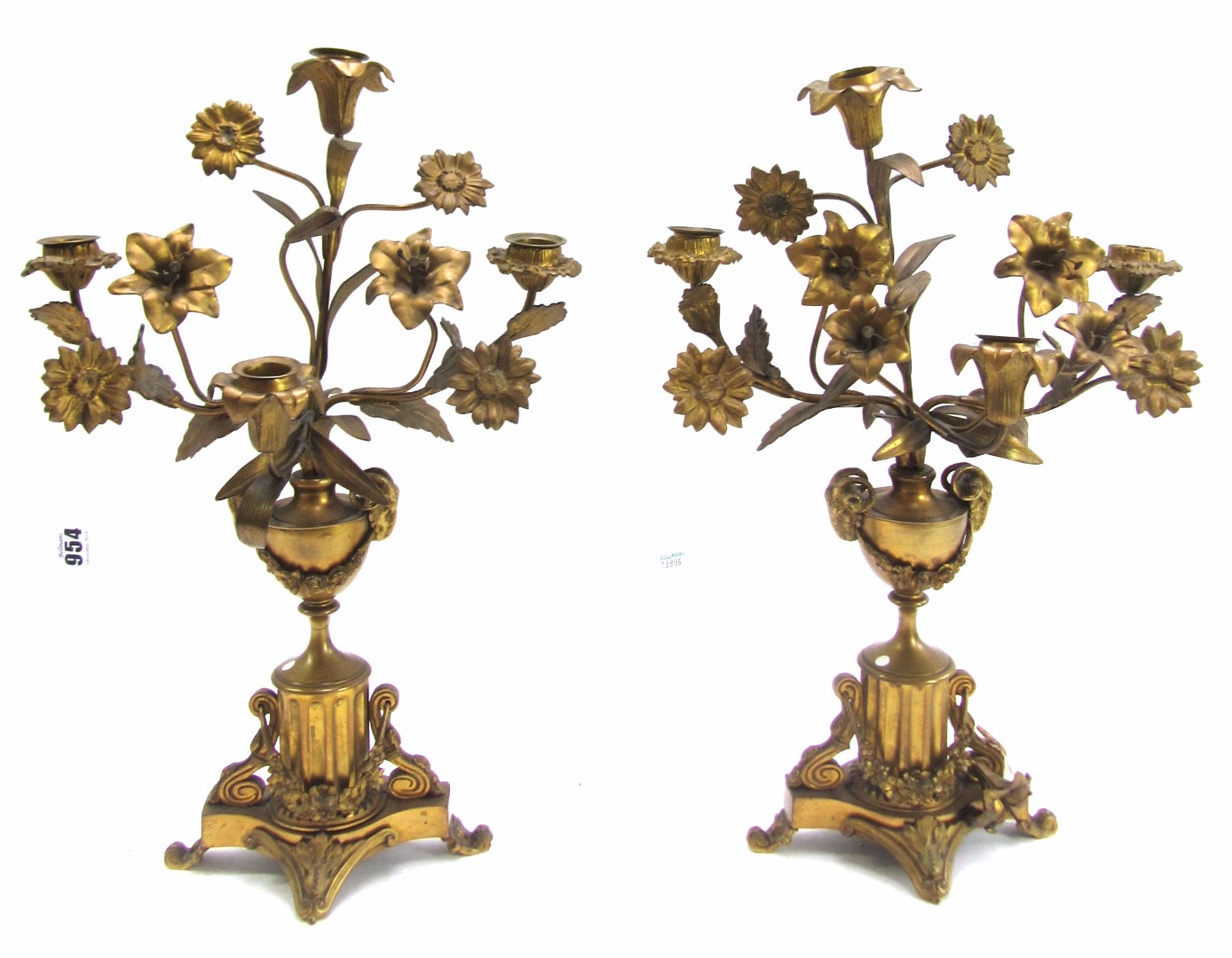 Appraisal: A pair of th century gilt metal four branch candelabra