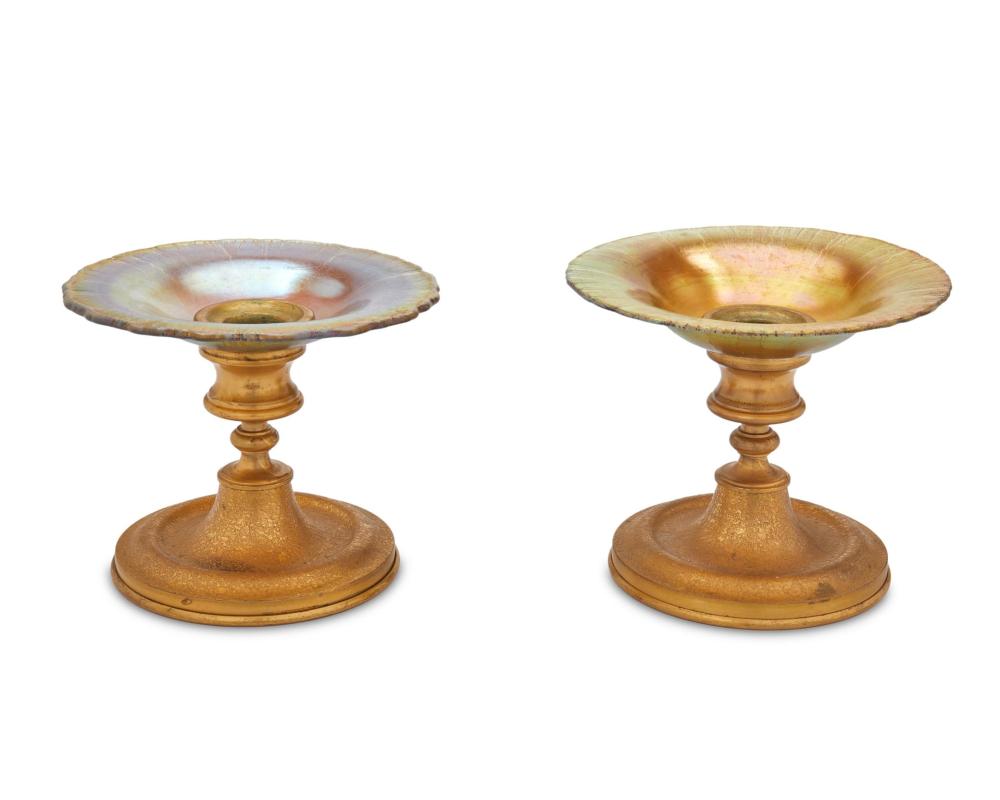 Appraisal: A near-pair of Tiffany Furnaces gilt-bronze and glass candlesticks Circa