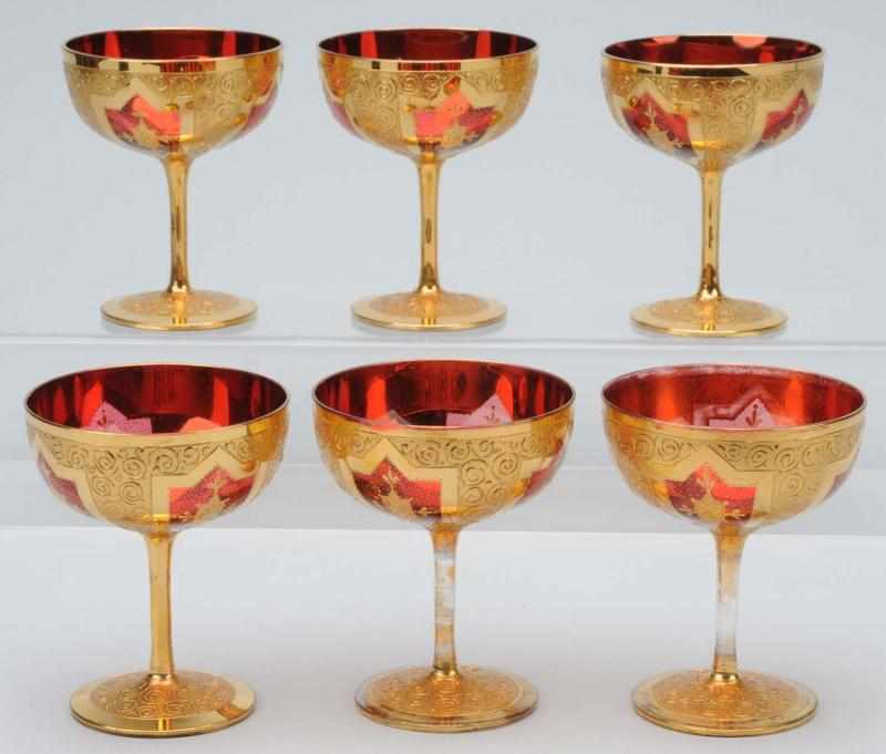 Appraisal: Set of Moser Ruby Champagne Glasses Description With heavy gilding