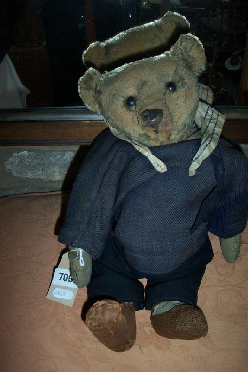 Appraisal: An early th century teddy with blond plush and button