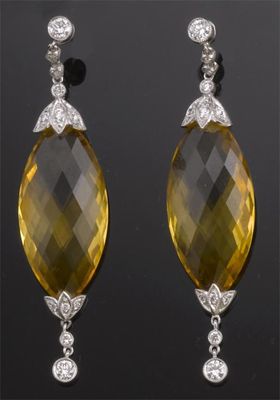 Appraisal: A pair of citrine and diamond drop earrings The marquise