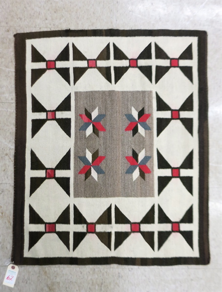 Appraisal: FINE NAVAJO SADDLE BLANKET centering four -point stars in red