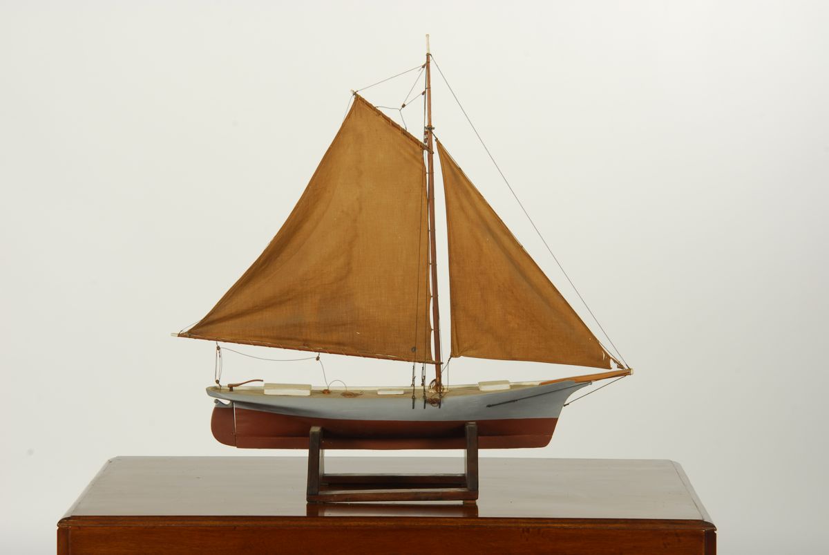 Appraisal: MODEL OF A GAFF-RIGGED CATBOAT WITH JIB Hollow body Painted