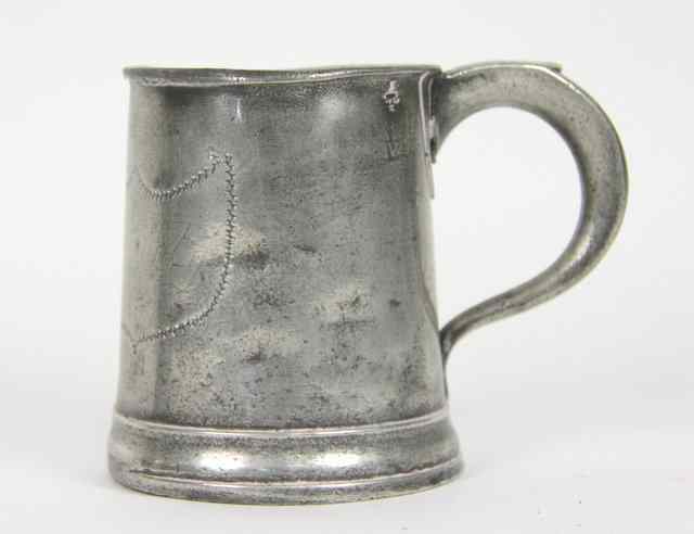 Appraisal: An early th Century pewter mug with single scroll handle