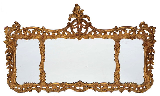 Appraisal: A CHIPPENDALE STYLE GILTWOOD FRAME THREE SECTIONAL OVERMANTEL MIRROR with