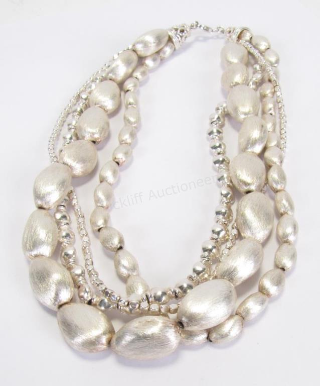 Appraisal: A four strand necklace each strand with sterling silver beads