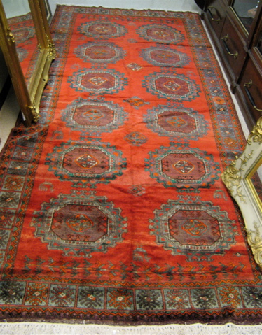 Appraisal: PERSIAN BELOUCHI TRIBAL CARPET the red field featuring two columns