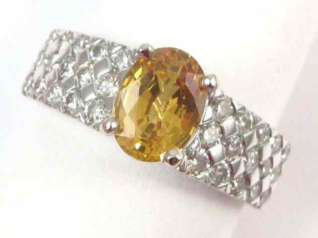 Appraisal: YELLOW SAPPHIRE AND DIAMOND RING k white gold ring with