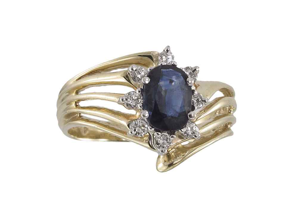 Appraisal: K SAPPHIRE DIAMOND RING K yellow gold ring centers a