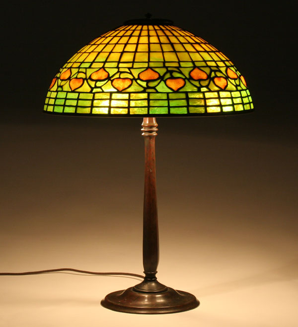 Appraisal: Leaded art glass and bronze table lamp in the acorn