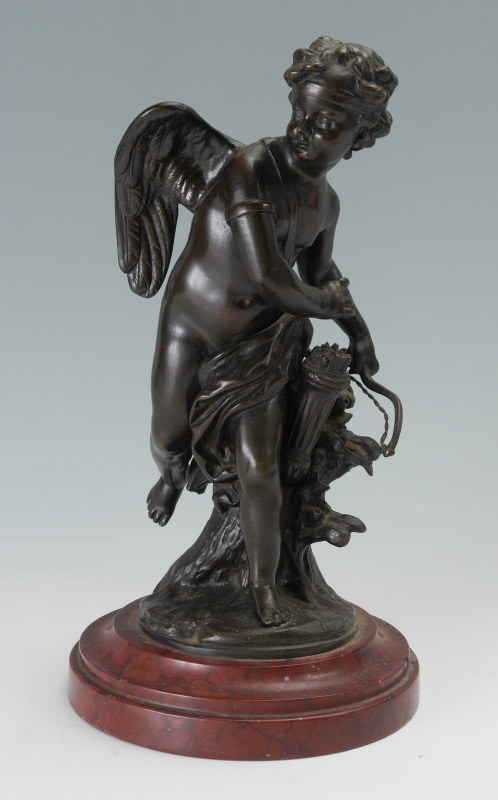 Appraisal: BRONZE CUPID FIGURE ON MARBLE BASE Bronze figure of cupid