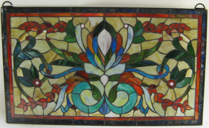 Appraisal: TWO STAINED AND LEADED GLASS WINDOW PANELS the first a