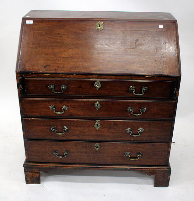 Appraisal: A GEORGE III MAHOGANY BUREAU the fall front enclosing a