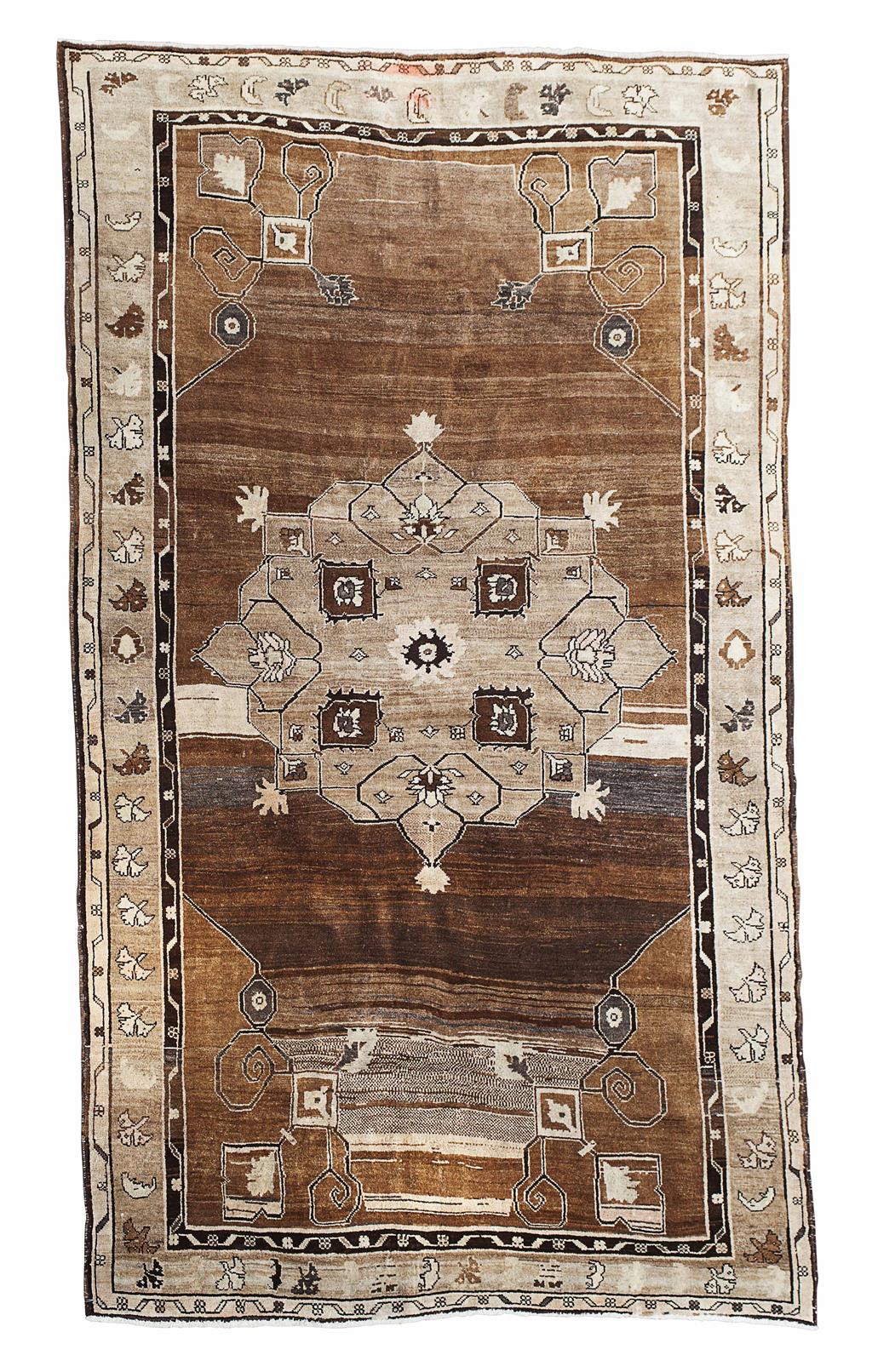 Appraisal: ANATOLIAN CARPET MID TH CENTURY the abrash brown field with