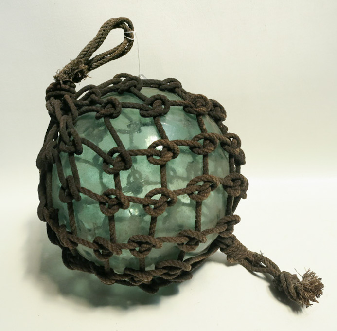 Appraisal: JAPANESE GLASS FISHING FLOAT with original net blue-green glass float