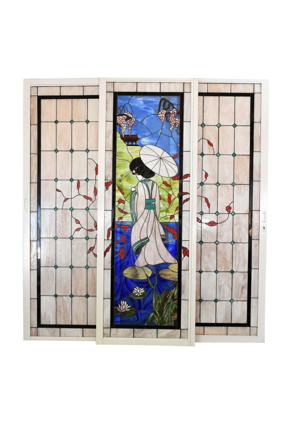 Appraisal: THREE LEADED STAINED-GLASS PANELS th Century The colorful center panel