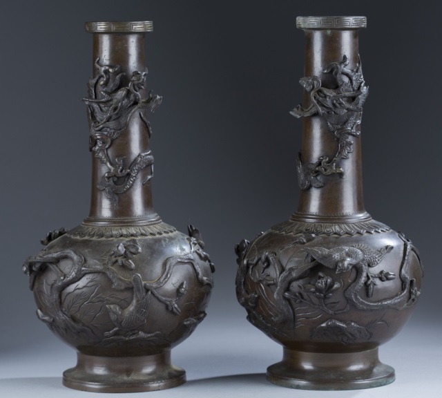 Appraisal: Pair of Chinese Bronze Vases An applied dragon wraps around