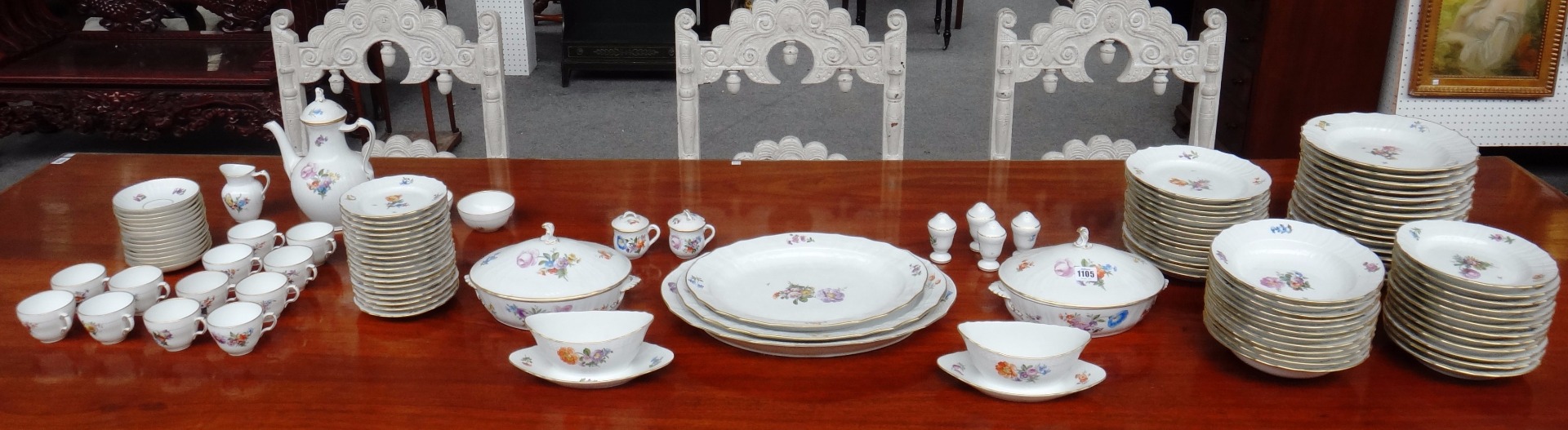 Appraisal: A Royal Copenhagen dinner and tea service decorated with floral