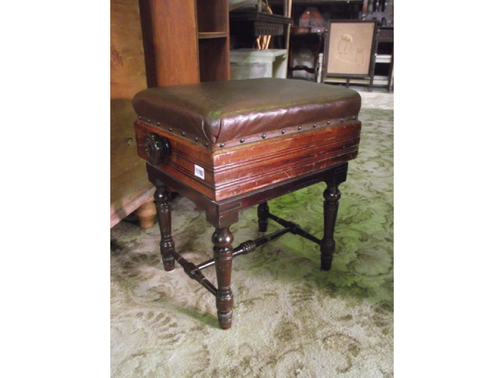 Appraisal: A late Victorian Edwardian walnut rise and fall adjustable music