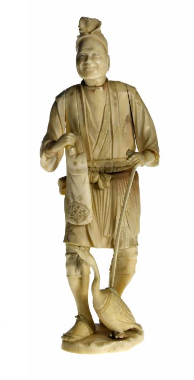 Appraisal: A SECTIONAL IVORY FIGURE OF A FISHERMAN WITH A CORMORANT