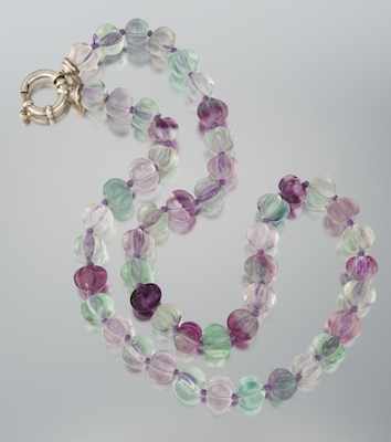 Appraisal: A Carved Fluorite Bead Necklace Individually strung carved fluted fluorite