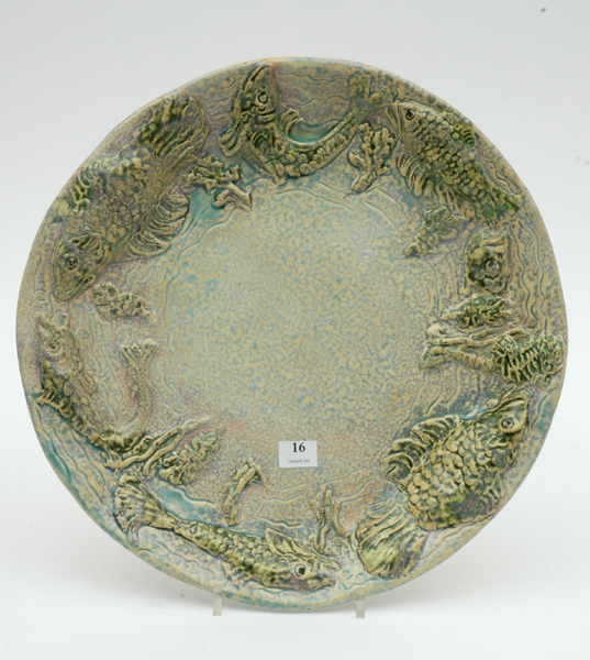 Appraisal: UNA DEERBON Victoria Circa Earthenware platter circular with a fish