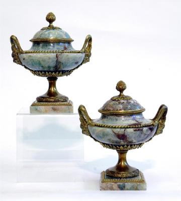 Appraisal: A PAIR OF SECOND EMPIRE URNS AND COVERS in green