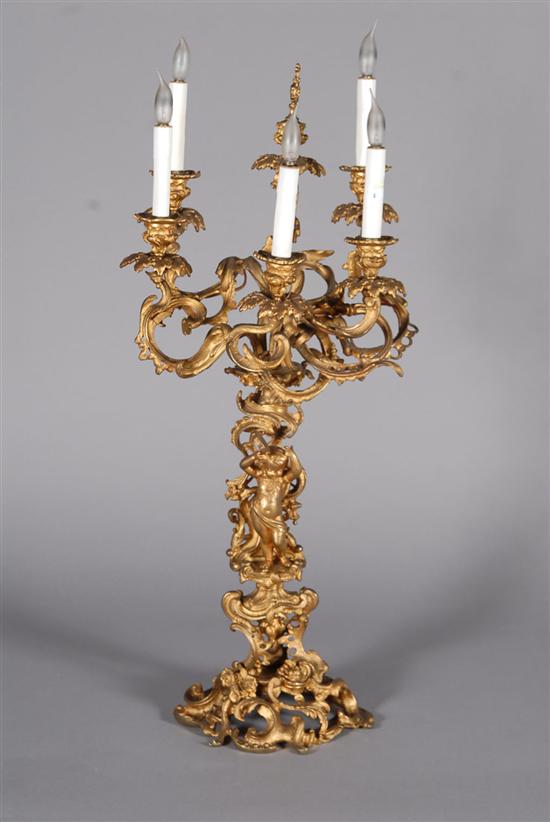 Appraisal: BRONZE CANDELABRUM Foliate scrolled form six light with reveller putto