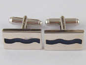 Appraisal: A pair of silver cufflinks gms