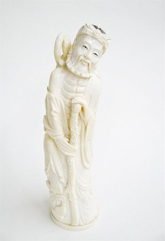 Appraisal: CARVED IVORY FIGURE China early th century God of Longevity