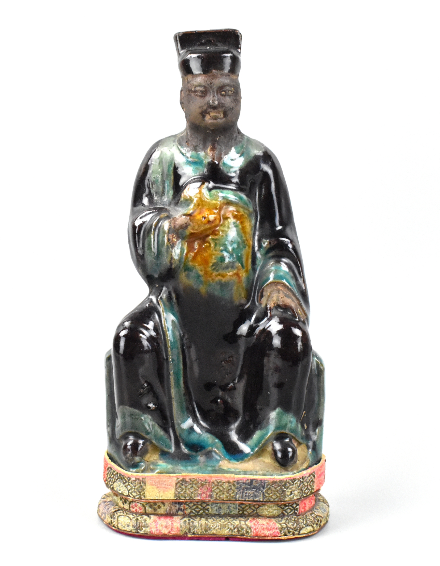 Appraisal: A Chinese fahua glazed seated figure dating from the Ming