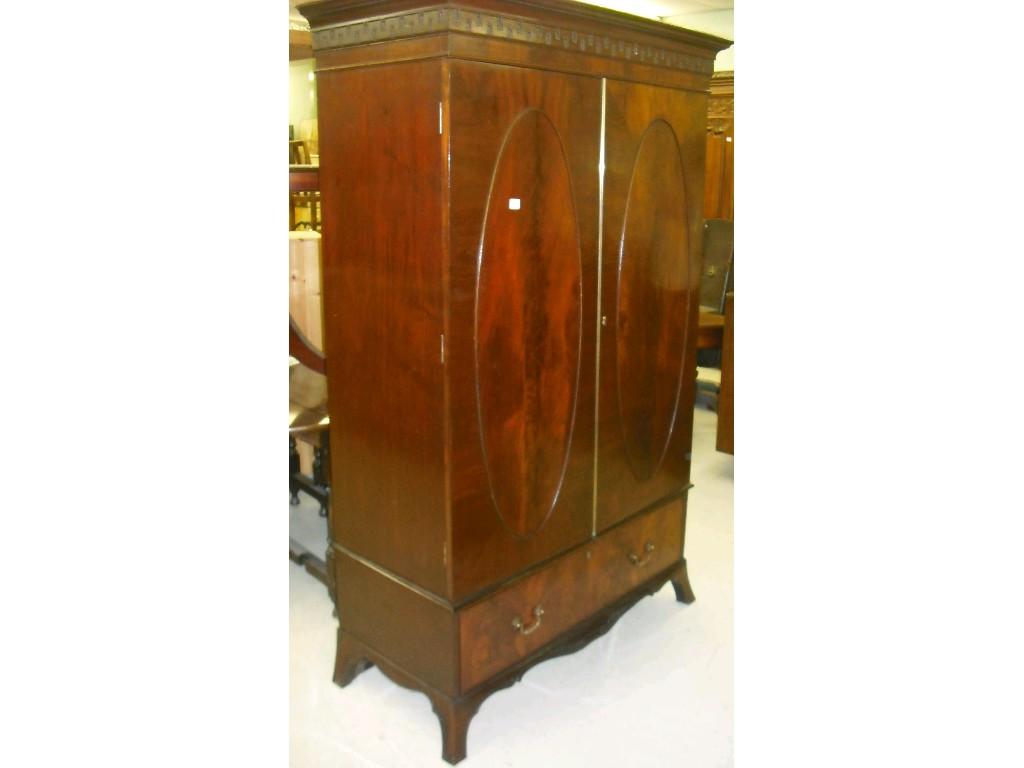 Appraisal: Early th Century flame mahogany wardrobe the moulded stepped carved