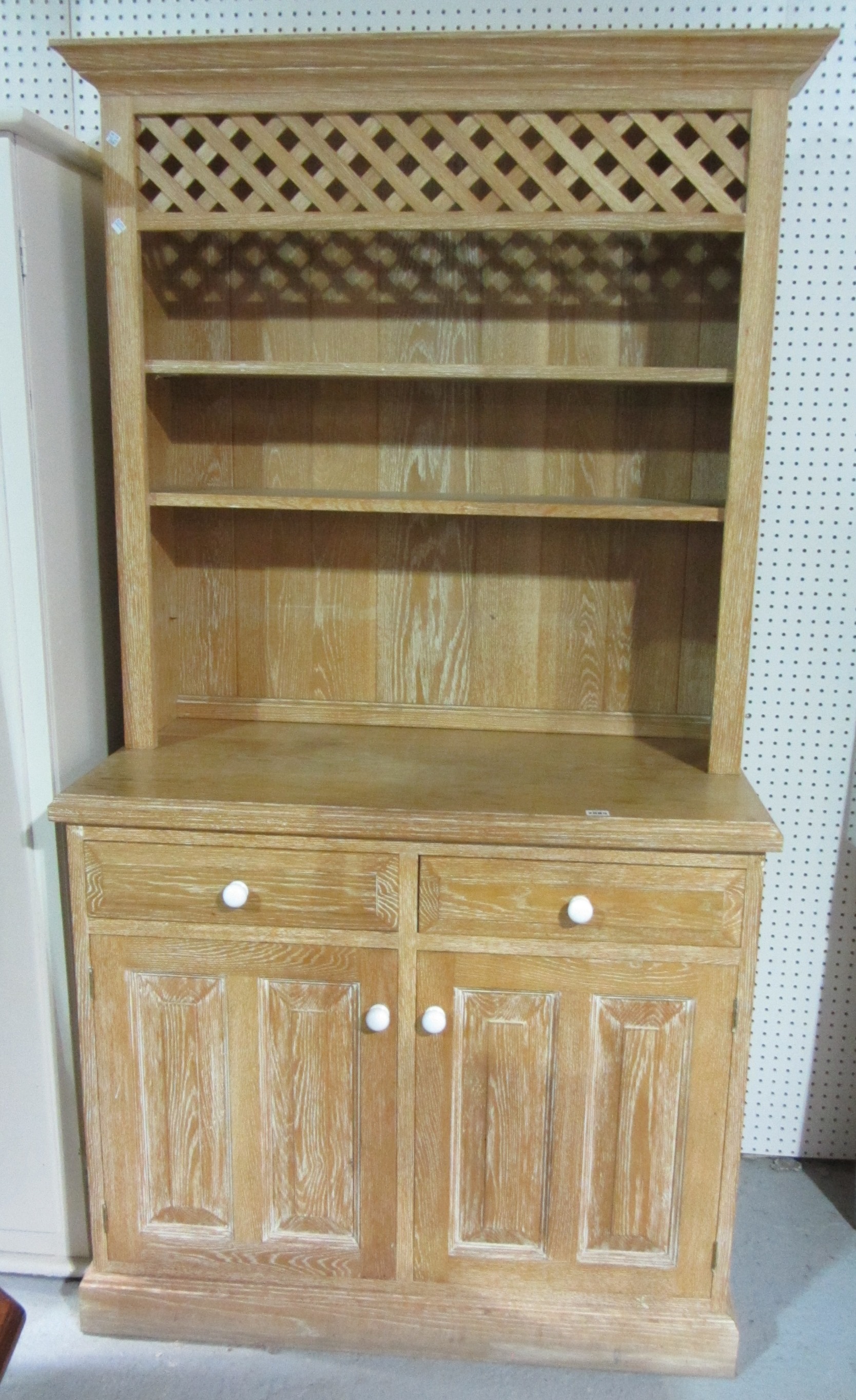 Appraisal: A th century limed oak dresser with three tier plate