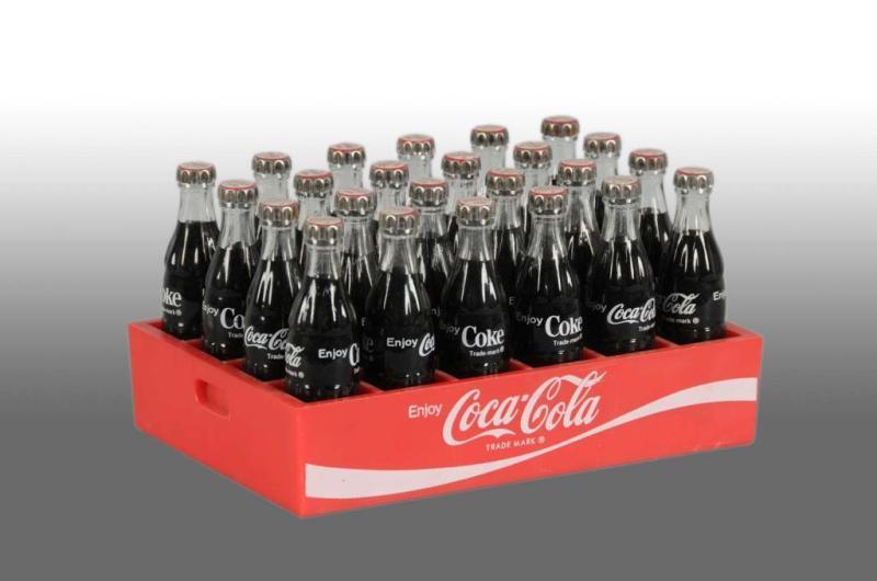 Appraisal: Plastic Coca-Cola Miniature Case with Bottles Description s Almost no