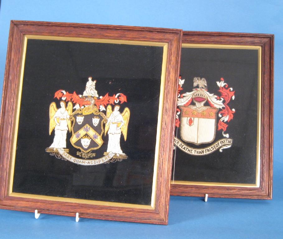 Appraisal: Pair of late th Century woven armorial Crests in glazed