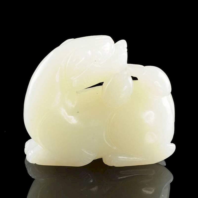 Appraisal: A CHINESE CARVED WHITE PALE GREEN JADE FIGURE OF A