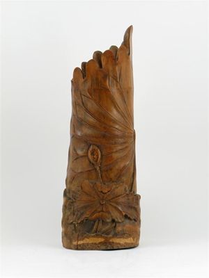 Appraisal: A large bamboo vase carved as a curled lotus leaf