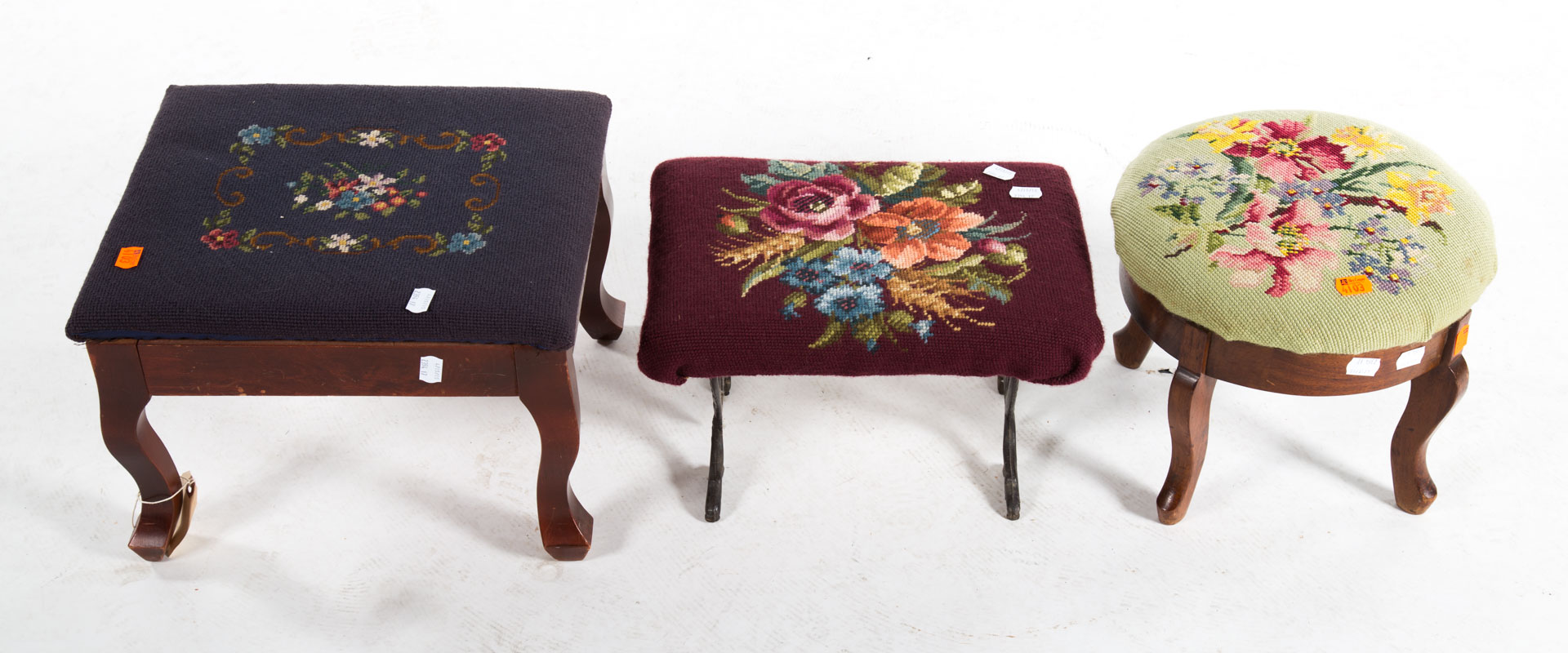 Appraisal: Three needlepoint upholstered footstools