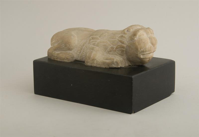 Appraisal: MEDIEVAL CARVED MARBLE FIGURE OF A CROUCHING LION Modeled facing