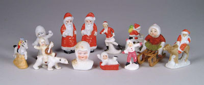 Appraisal: GERMAN SNOW FIGURINES Santa on reindeer Santa on top of