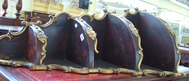 Appraisal: A faux rosewood and gilt graduated four tier hanging corner