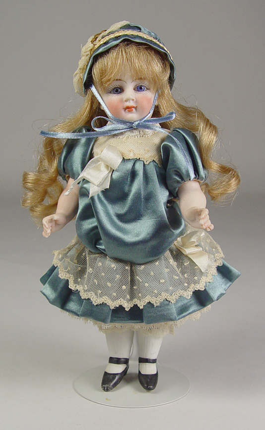 Appraisal: German All-Bisque Girl Pale bisque with blue set glass eyes