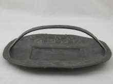 Appraisal: Archibald Knox An oval pewter tray with carrying handle decorated