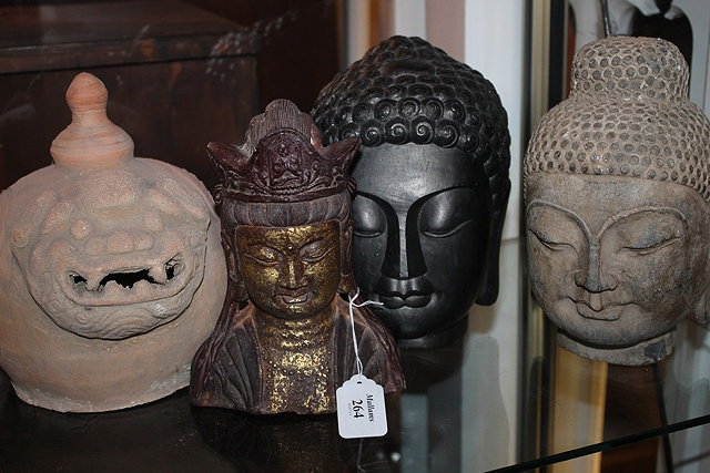 Appraisal: A TIBETAN STYLE CAST METAL BUDDHA HEAD two other buddha