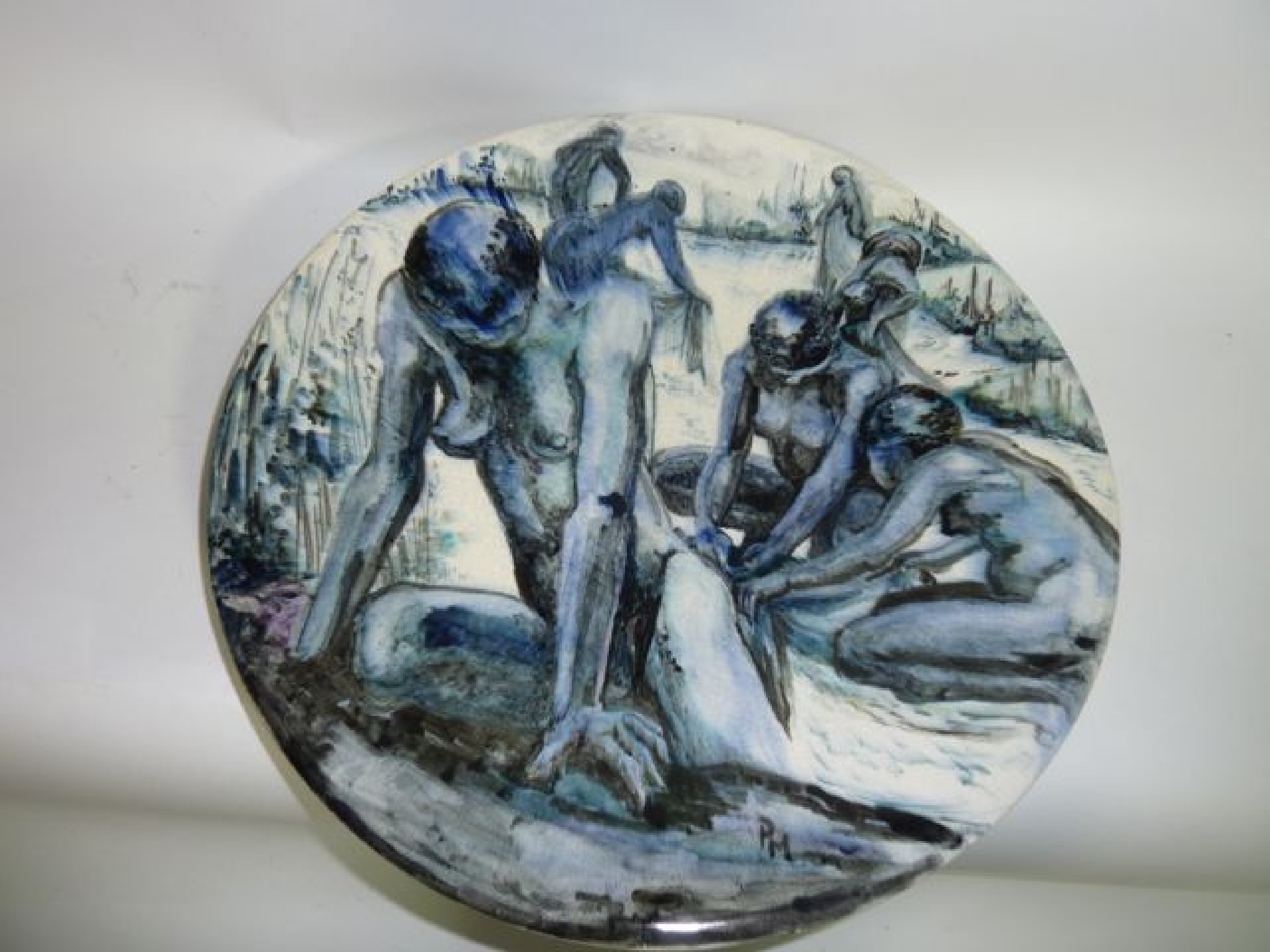 Appraisal: An unusual Studio Pottery charger with painted decoration of naked