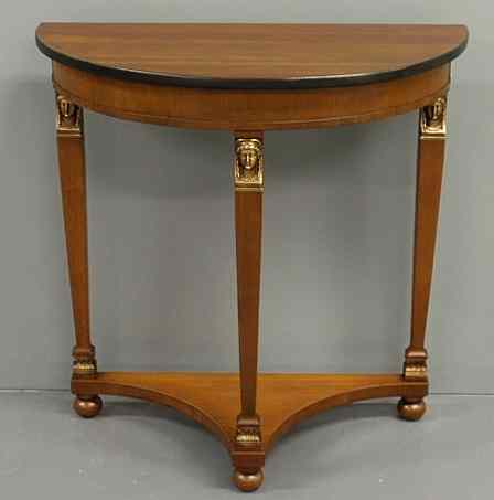 Appraisal: French empire style cherry demilune table h x w x