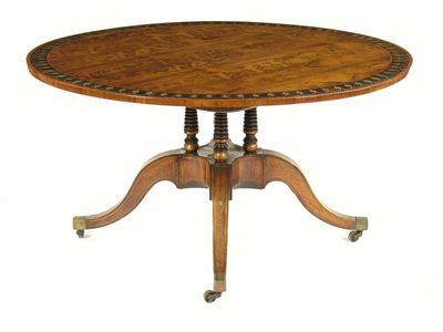 Appraisal: A Regency rosewood and brass marquetry centre table the circular