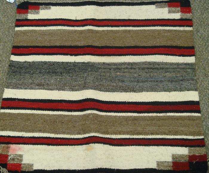 Appraisal: Native American rugs red brown pink black geometric good conditions